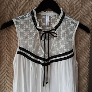 Sleeveless ivory blouse